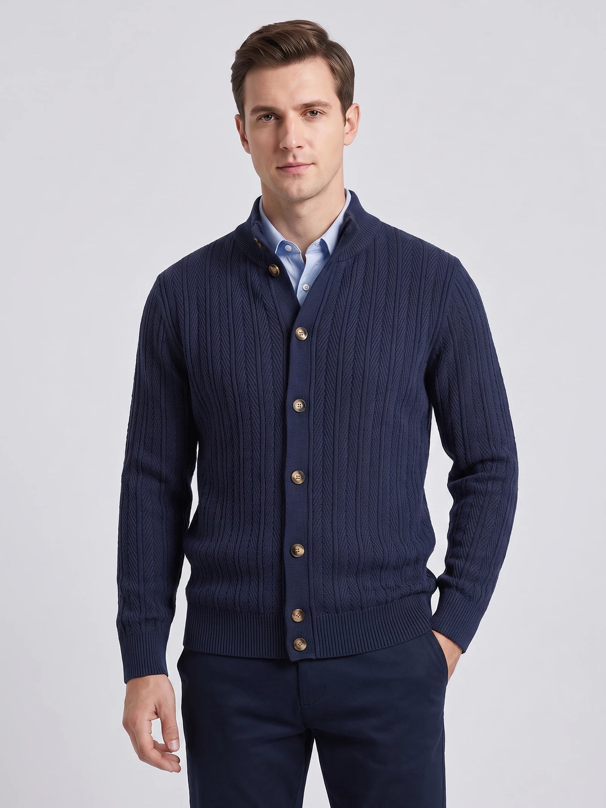 Model wearing a Navy cotton Button Up Cardigan with a stand collar, textured knit pattern, and ribbed cuffs in a front studio view.