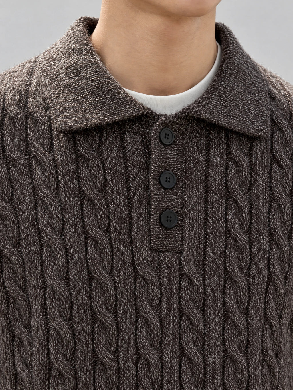 Close-up of the Brown Cable Knit Pullover showing the polo collar, three-button placket, and textured cable knit.