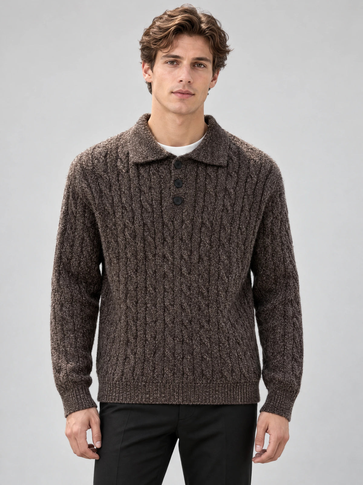Front studio view of a model wearing a Brown cable knit pullover with a polo collar and three-button placket.