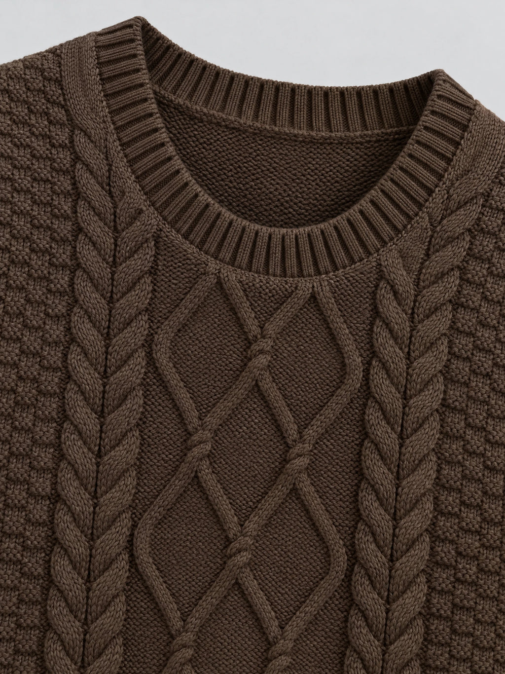 Close-up of the Brown Cable Knit Sweater Vest showing the ribbed round neckline and raised cable-knit texture.