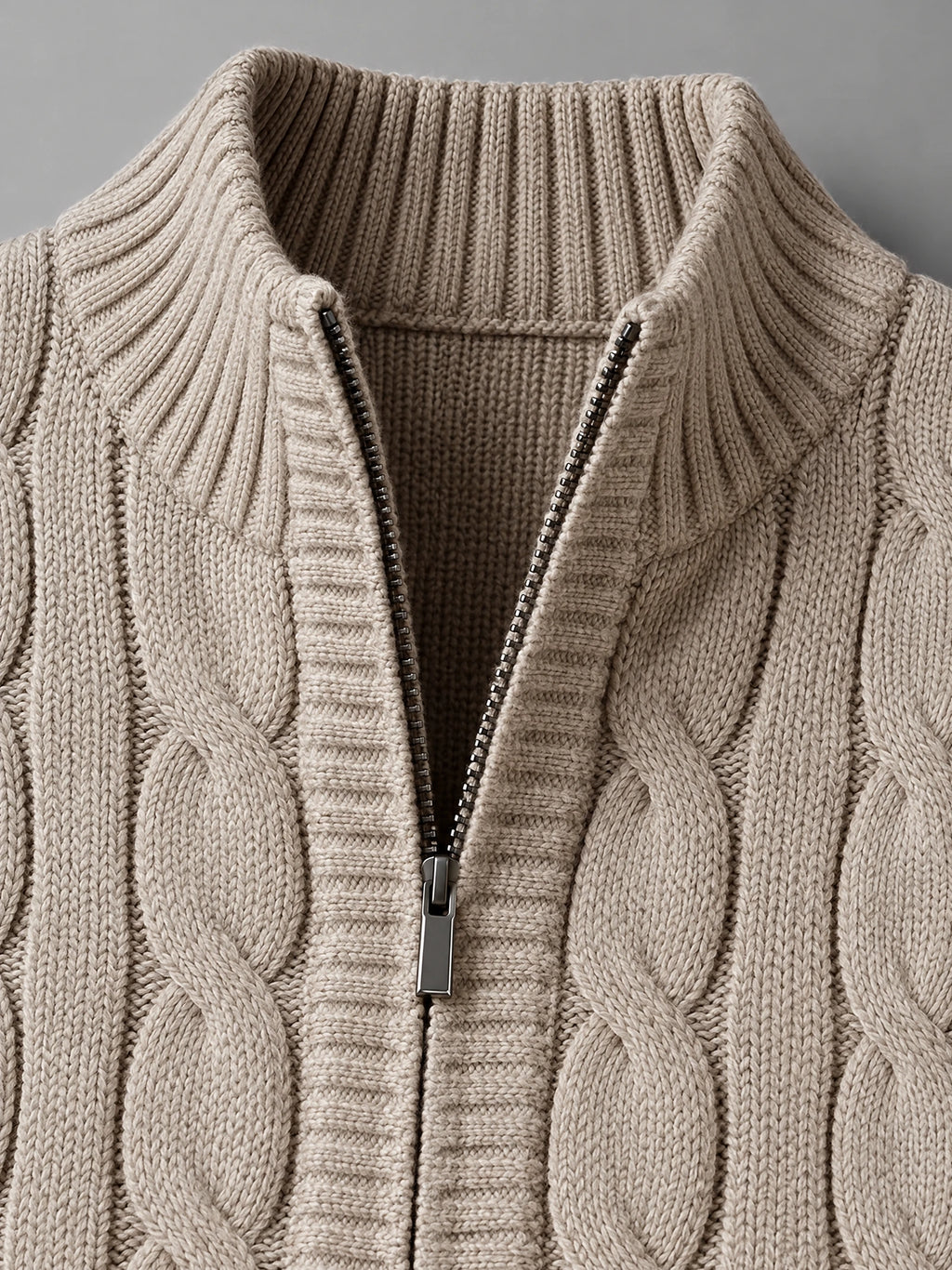 Khaki cable knit sweater vest detail showing the ribbed stand collar and half-zip closure.