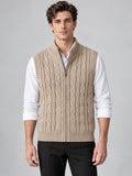 Front studio view of a model wearing a Khaki cable knit sweater vest with a ribbed half-zip collar.