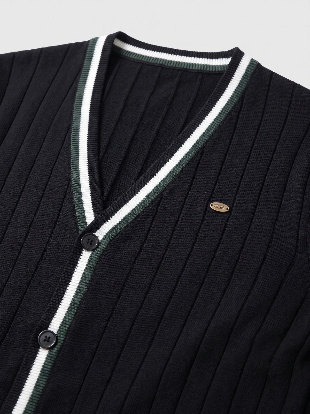 Close-up of a Black cotton Cardigan Sweater with ribbed knit texture, striped V-neck trim, and button-front detailing.