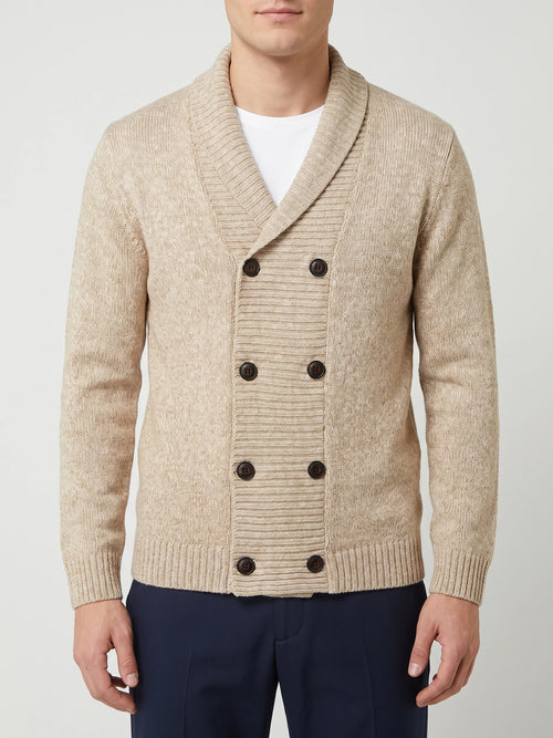 Front studio view of a model wearing a Beige Cardigan Sweater with a ribbed shawl collar and double-breasted button front.