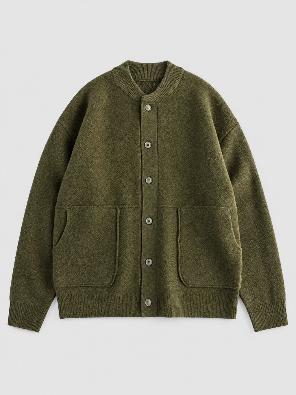 Green wool Cardigan Sweater laid flat, featuring a ribbed round neck, button front, and two patch pockets.