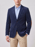 Front studio view of a model wearing a Navy corduroy blazer with notch lapels, flap pockets, and elbow patches.