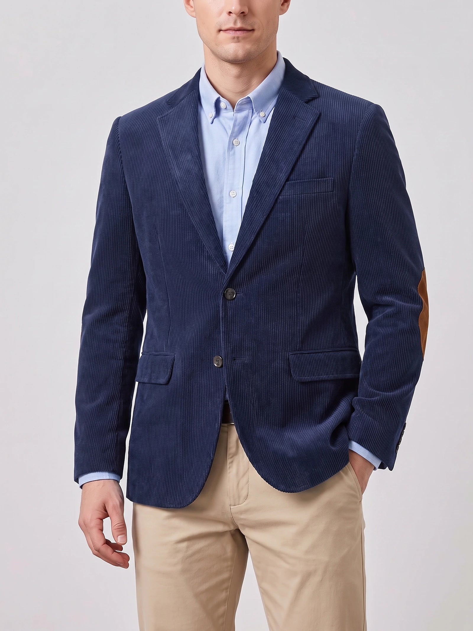 Front studio view of a model wearing a Navy corduroy blazer with notch lapels, flap pockets, and elbow patches.