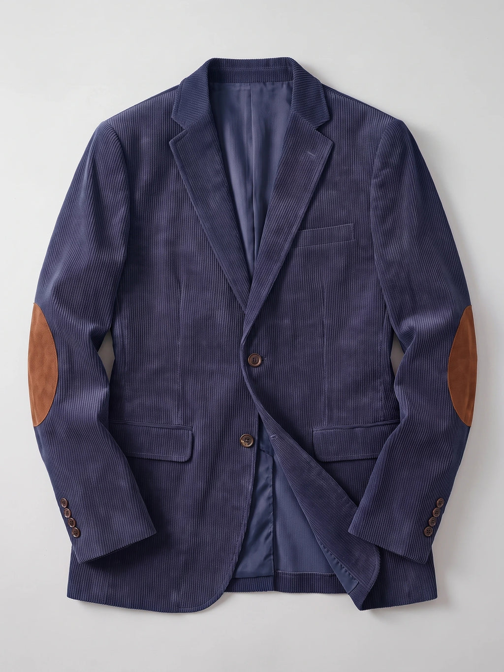 Navy corduroy blazer laid flat, showing notched lapels, flap pockets, button cuffs, and elbow patches.