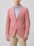 Front studio view of a model wearing a Pink corduroy blazer with notch lapels, flap pockets, two-button closure, and elbow patches.