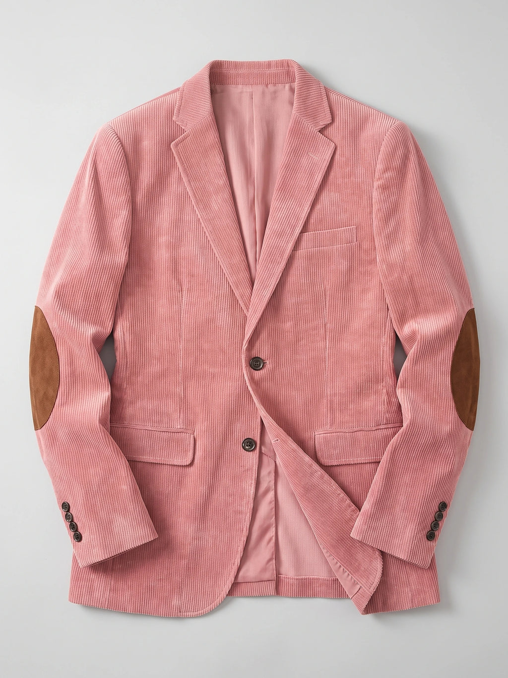 Pink corduroy blazer laid flat, featuring notched lapels, flap pockets, button cuffs, and elbow patches.