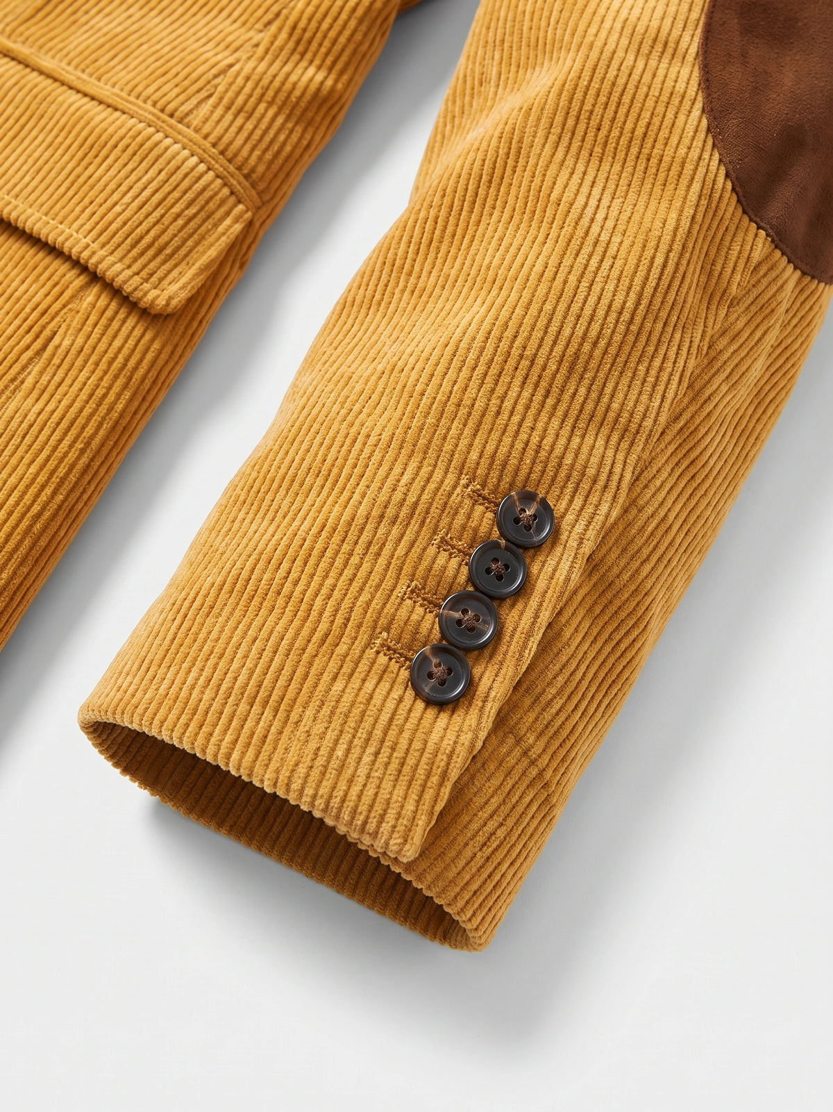 Yellow Corduroy Blazer close-up showing the ribbed sleeve cuff with four buttons and an elbow patch.