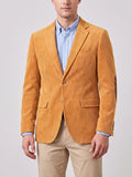 Front studio view of a model wearing a Yellow corduroy blazer with notch lapels, two-button closure, flap pockets, and elbow patches.