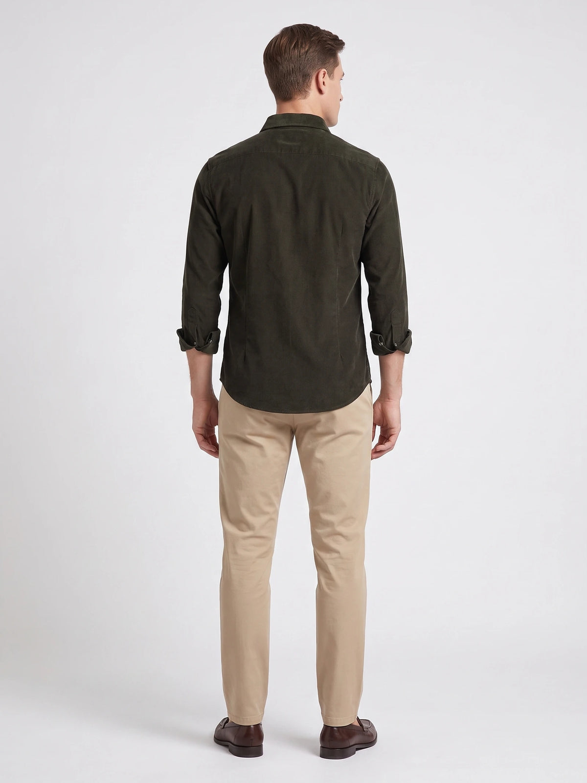 Rear studio view of a model wearing a Green men's cotton Corduroy Shirt with rolled cuffs.