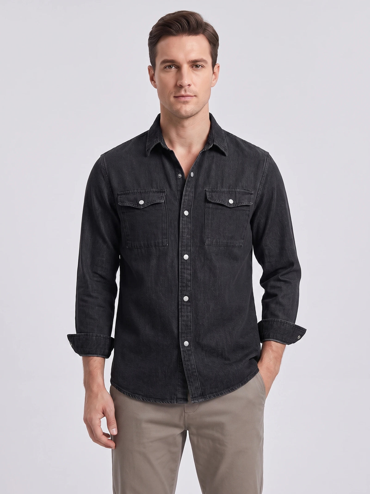 Model wearing a Black cotton Cowboy Shirt in a front studio view, featuring snap buttons and two flap chest pockets.