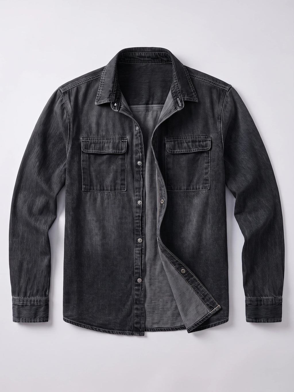 Black cotton Cowboy Shirt laid flat with long sleeves, a button front, and two flap chest pockets.
