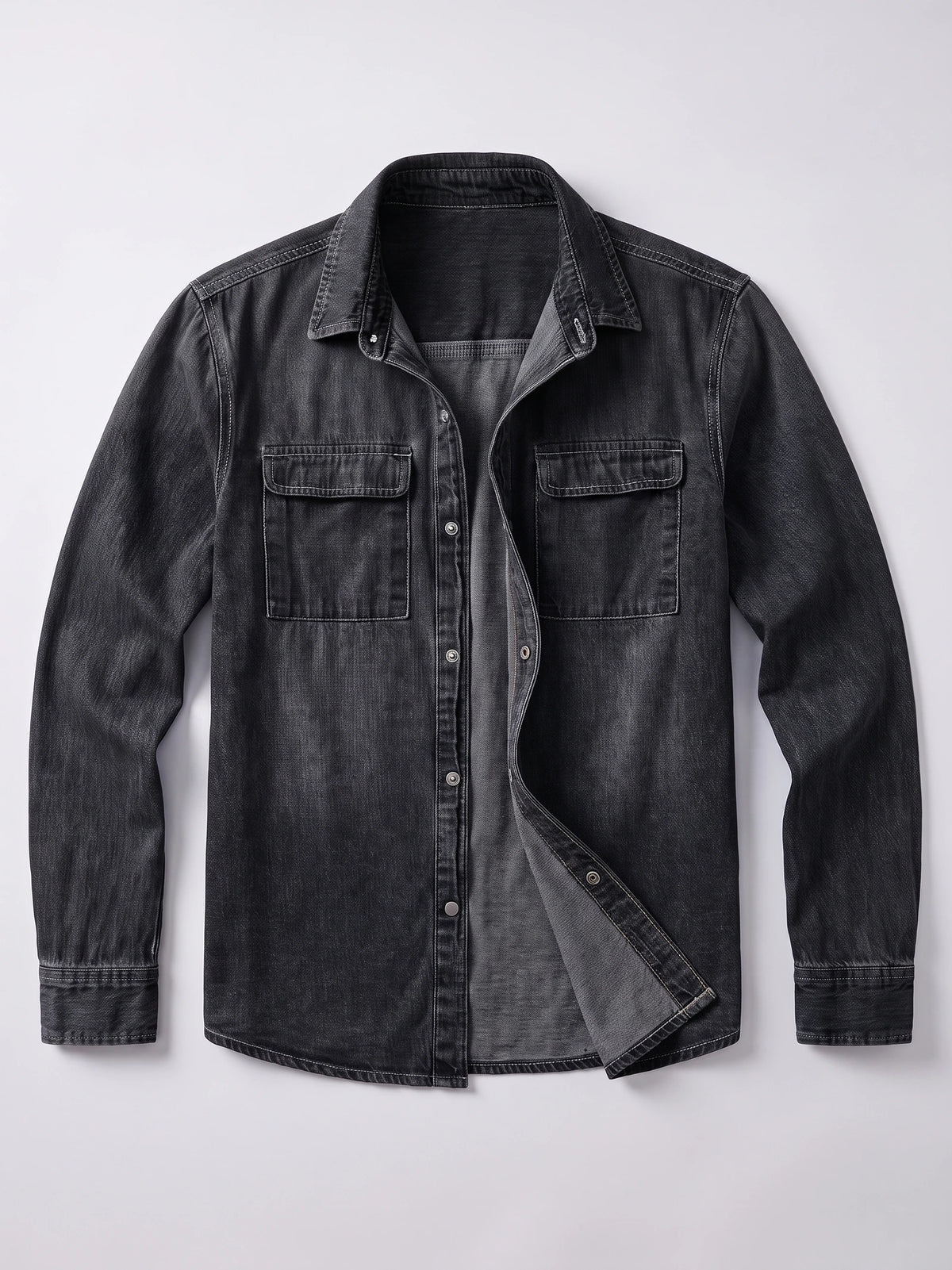 Black cotton Cowboy Shirt laid flat with long sleeves, a button front, and two flap chest pockets.