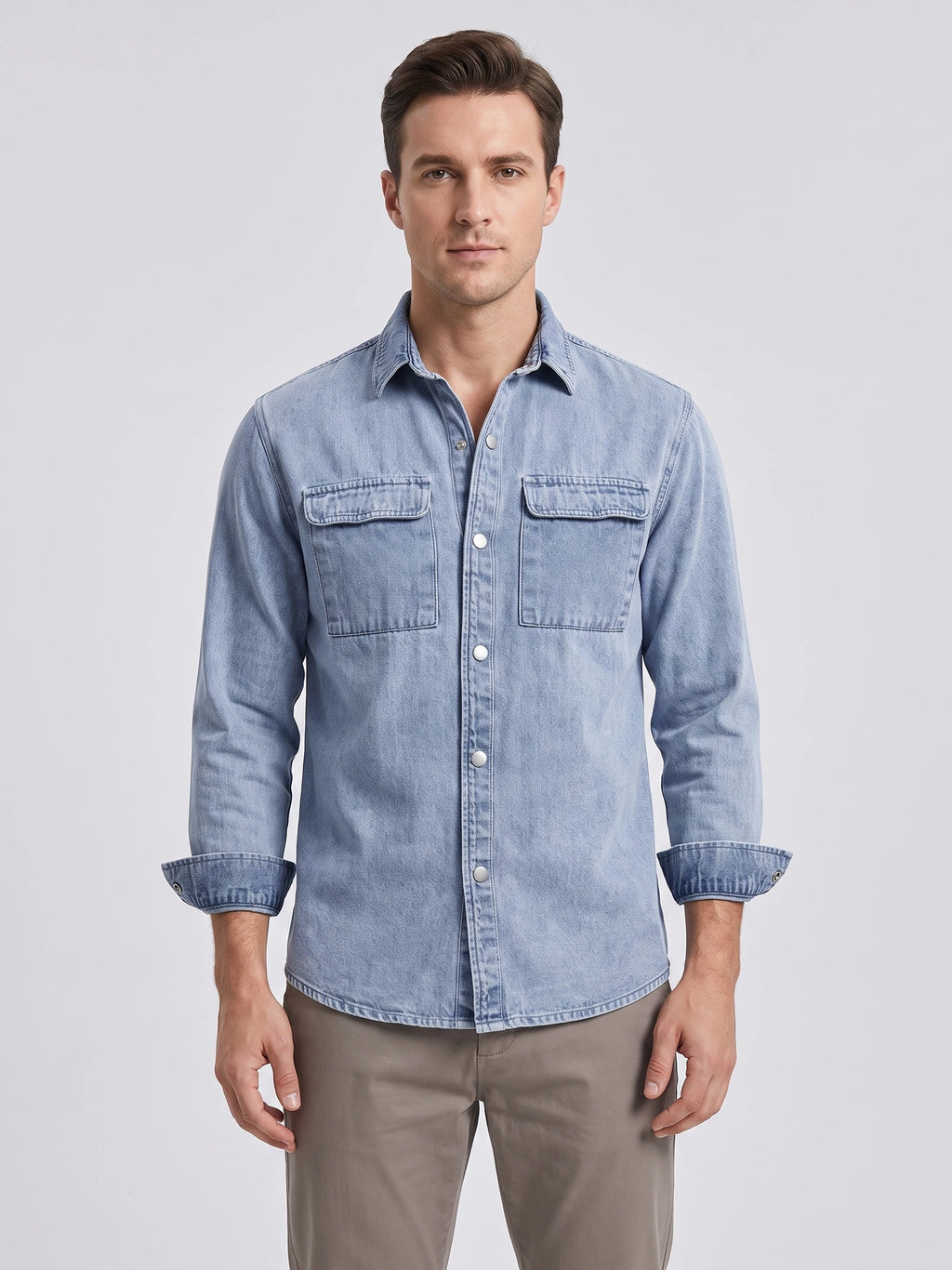 Front studio view of a model wearing a Blue cotton Cowboy Shirt with snap buttons and two flap chest pockets.