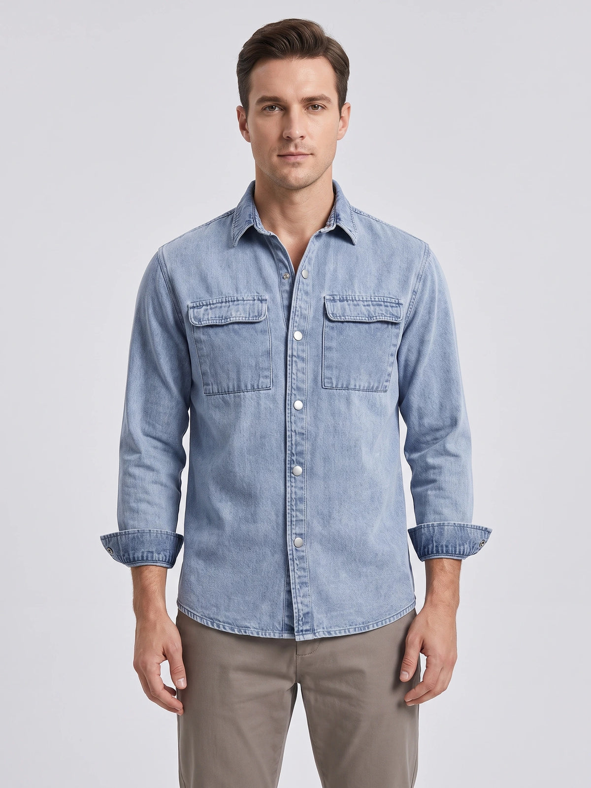 Front studio view of a model wearing a Blue cotton Cowboy Shirt with snap buttons and two flap chest pockets.