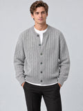 Front studio view of a model wearing a Gray crewneck cardigan with cable-knit texture, button front, and ribbed trim.