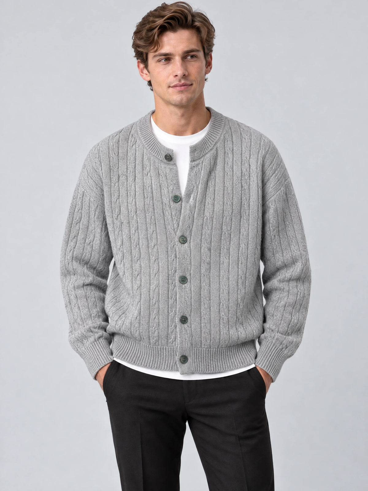 Front studio view of a model wearing a Gray crewneck cardigan with cable-knit texture, button front, and ribbed trim.