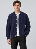 Front studio view of a model wearing a Navy crewneck cardigan with cable-knit texture, button front, and ribbed trim.