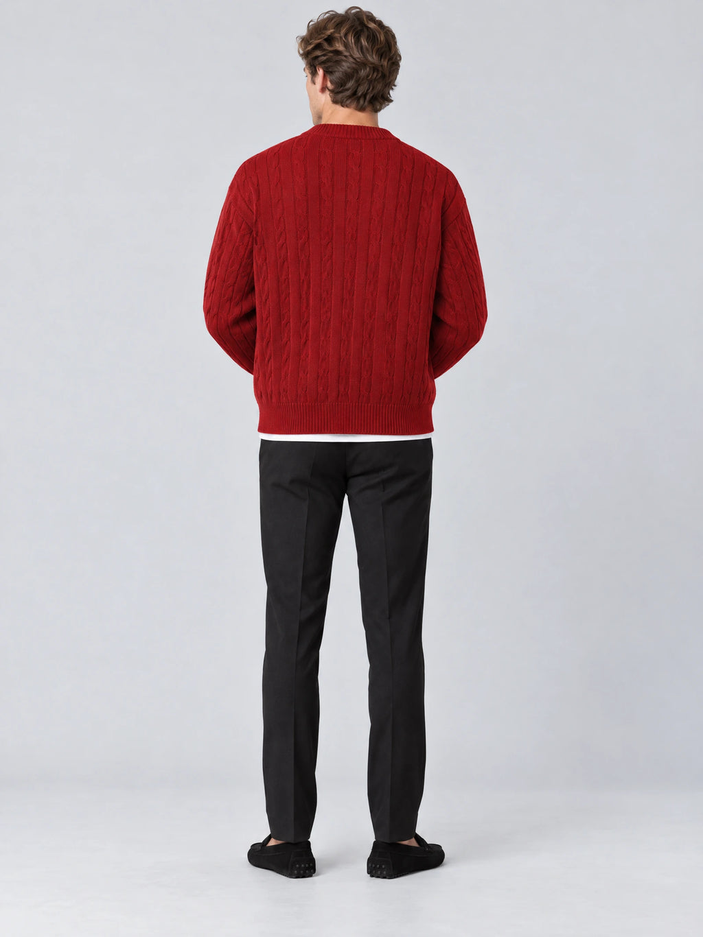 Rear studio view of a model wearing a Red crewneck cardigan with vertical cable-knit texture and ribbed hem.