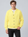 Front studio view of a model wearing a Yellow crewneck cardigan with cable-knit texture, button front, and ribbed cuffs and hem.