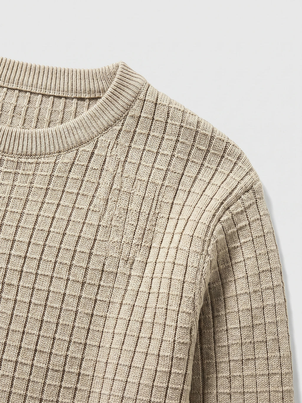 Close-up of the ribbed crew neckline and textured vertical knit pattern on a Beige men's crewneck sweater.