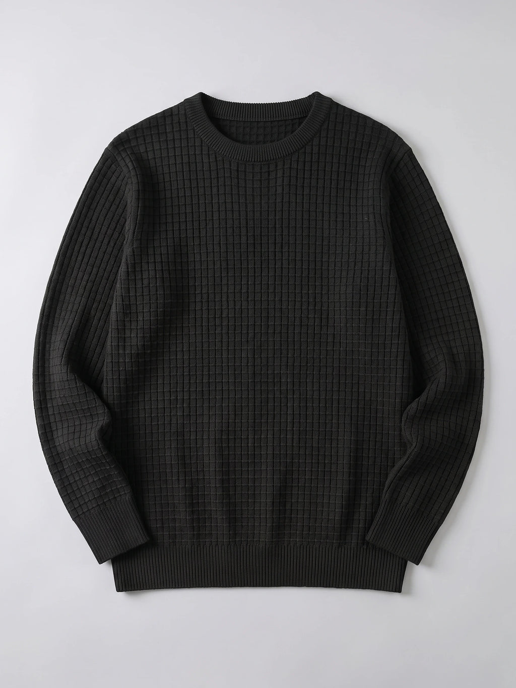 Black men's crewneck sweater laid flat, featuring a textured grid-knit body and ribbed collar, cuffs, and hem.