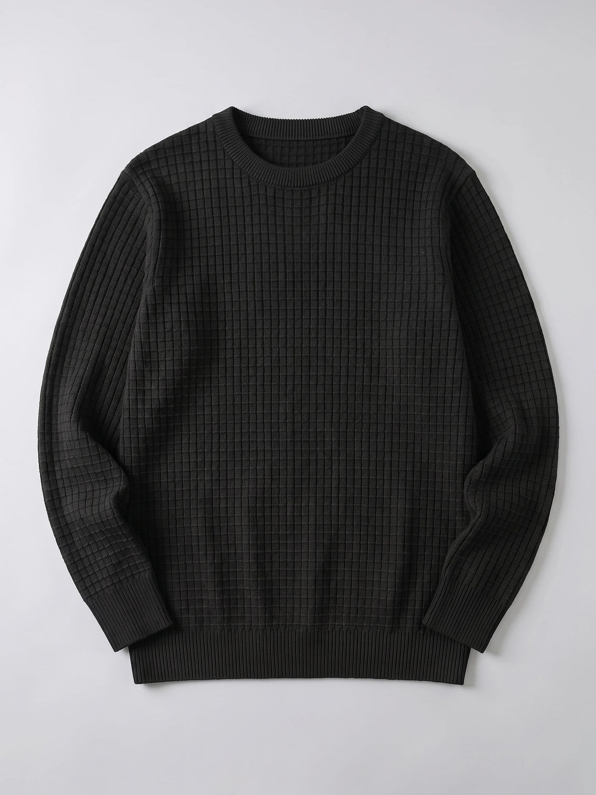 Black men's crewneck sweater laid flat, featuring a textured grid-knit body and ribbed collar, cuffs, and hem.