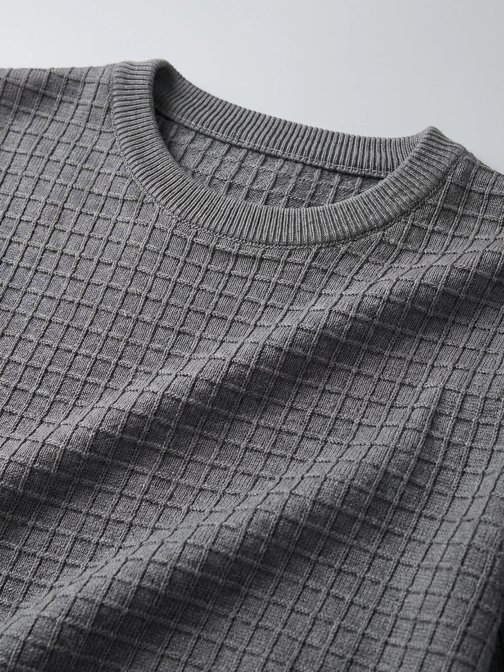 Close-up of the ribbed crew neckline and textured knit pattern on a Gray Men's Crewneck Sweater.
