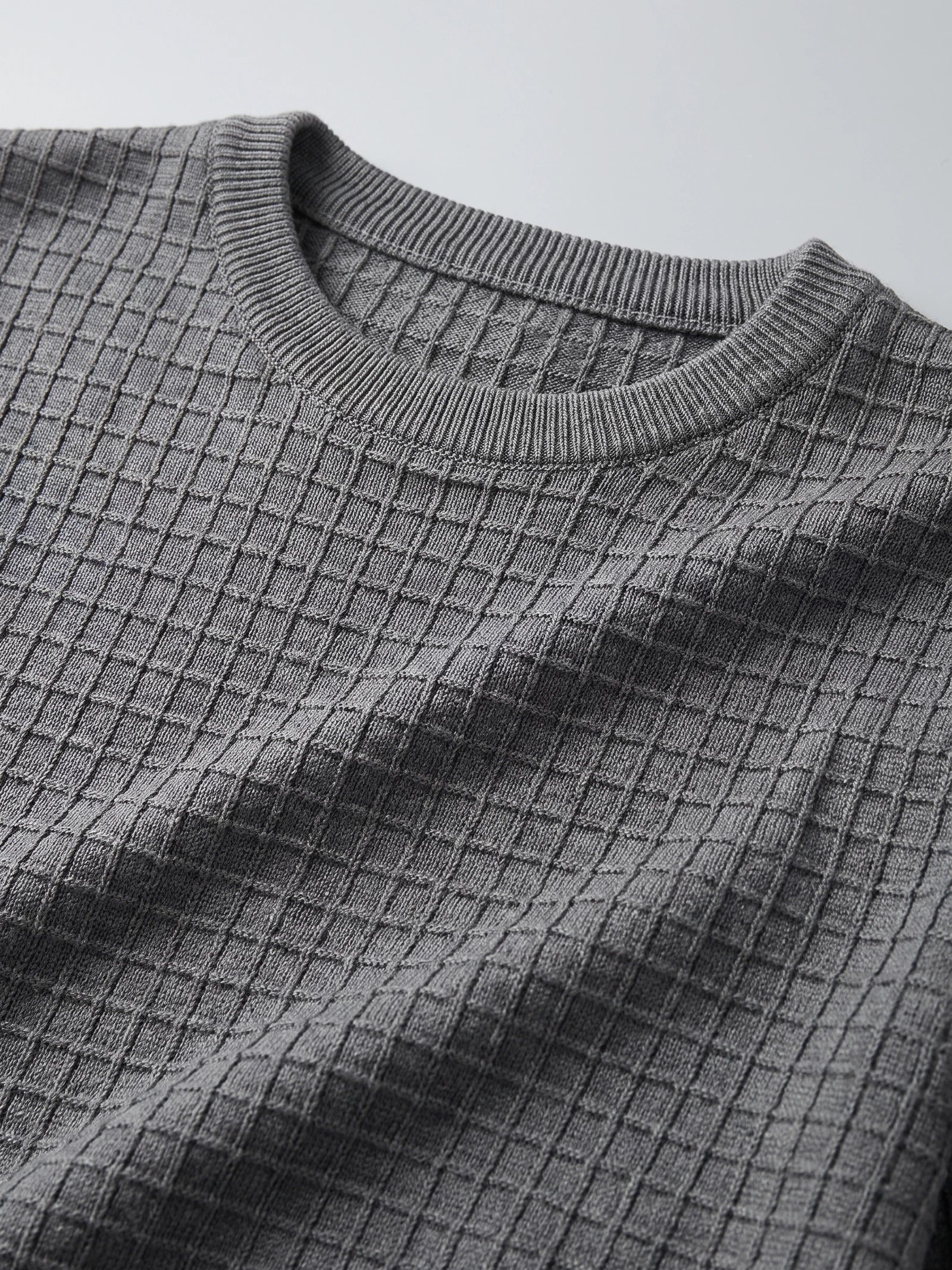 Close-up of the ribbed crew neckline and textured knit pattern on a Gray Men's Crewneck Sweater.