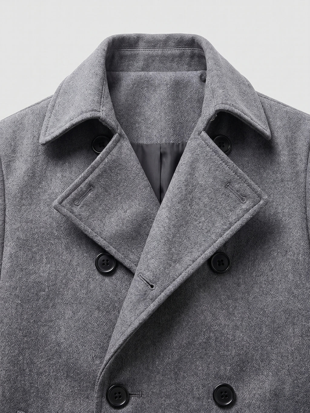 Close-up of the Gray men’s Trench Coat showcasing its turn-down collar, textured fabric, and double-breasted button closure.