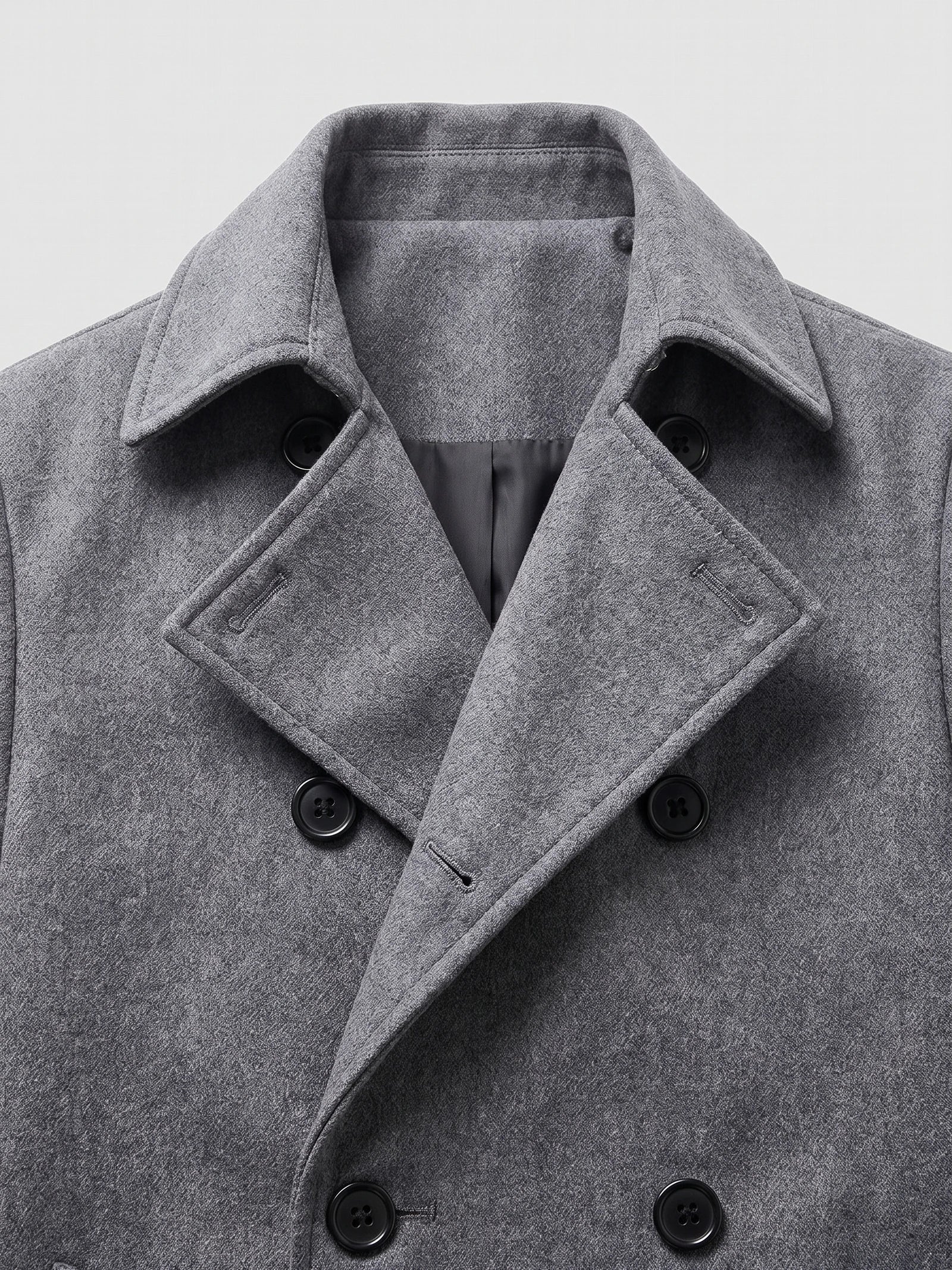 Close-up of the Gray men’s Trench Coat showcasing its turn-down collar, textured fabric, and double-breasted button closure.