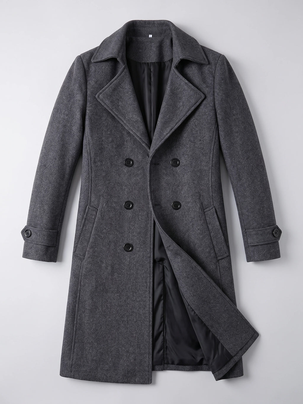 Gray men’s double-breasted trench coat laid flat, featuring wide lapels, buttoned cuffs, and an open front showing the lining.