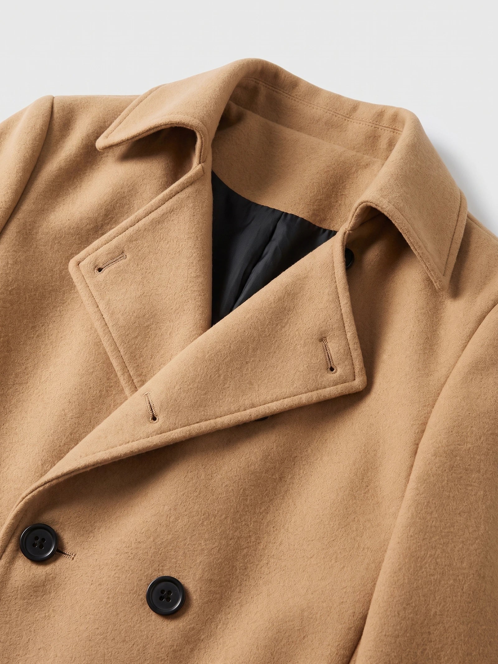 Close-up of the Khaki men's trench coat showing its turn-down collar, double-breasted button front, and inner lining.