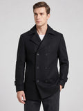 Front studio view of a model wearing a Black wool double-breasted Peacoat with wide lapels and cuff tabs.