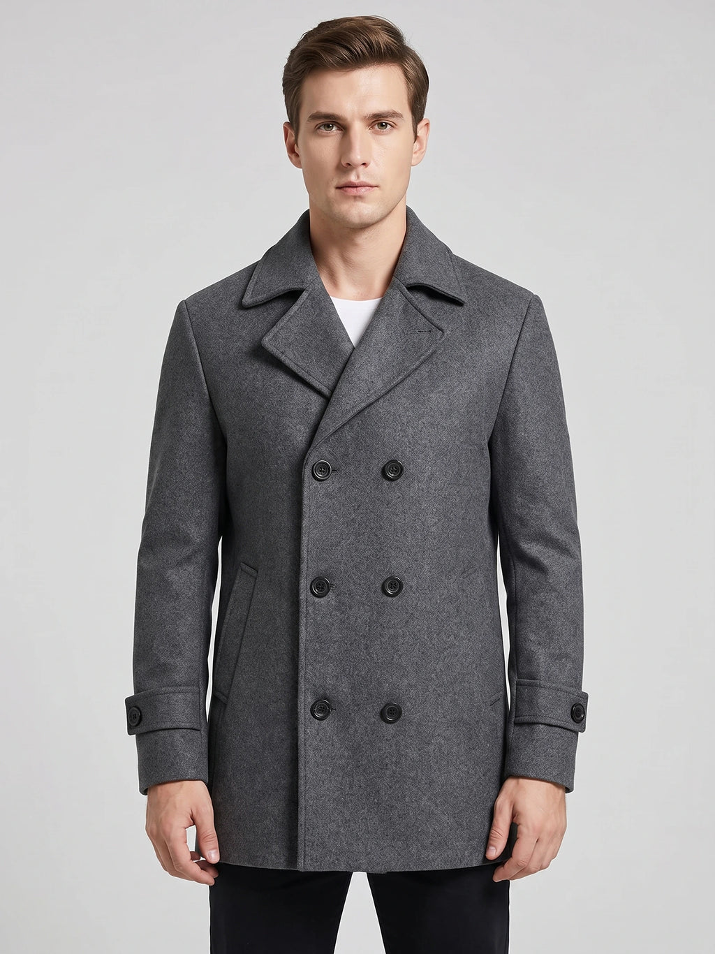 Front studio view of a model wearing a Gray wool double-breasted Peacoat with wide lapels and cuff tabs.