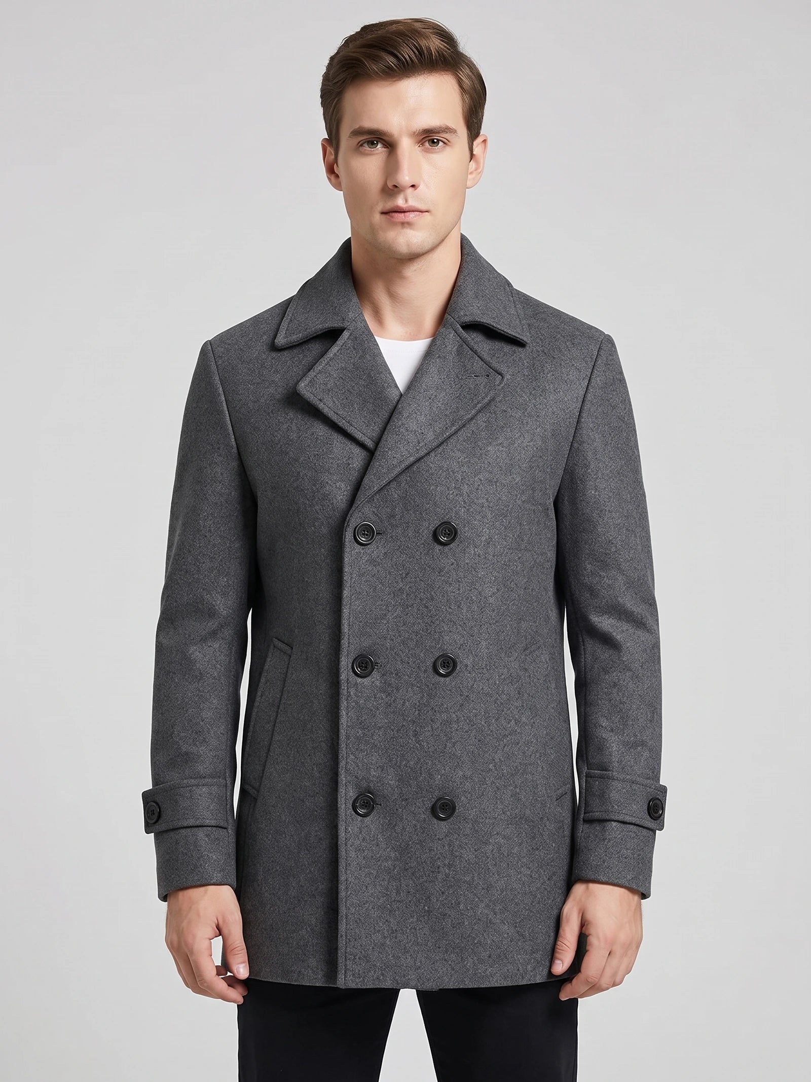 Front studio view of a model wearing a Gray wool double-breasted Peacoat with wide lapels and cuff tabs.
