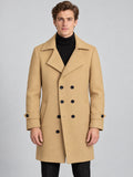 Front studio view of a model wearing a Khaki double-breasted woolen coat with wide lapels and cuff tabs.