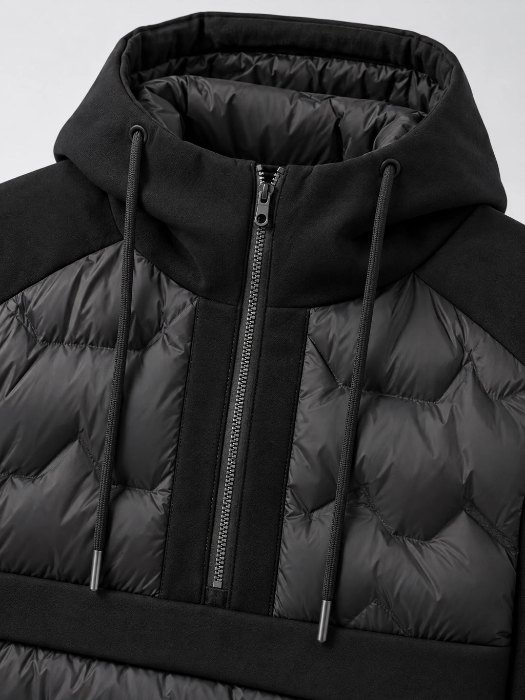 Close-up of the Black Down Jacket showing the padded stand collar, front zipper, drawcords, and quilted panels.