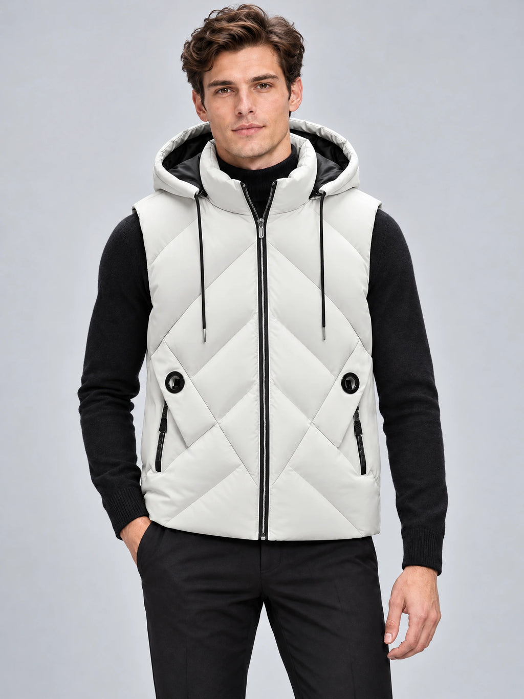 Front studio view of a model wearing a White Down Vest with a hood, zip closure, diagonal quilting, and zip pockets.