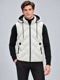Front studio view of a model wearing a White Down Vest with a hood, zip closure, diagonal quilting, and zip pockets.