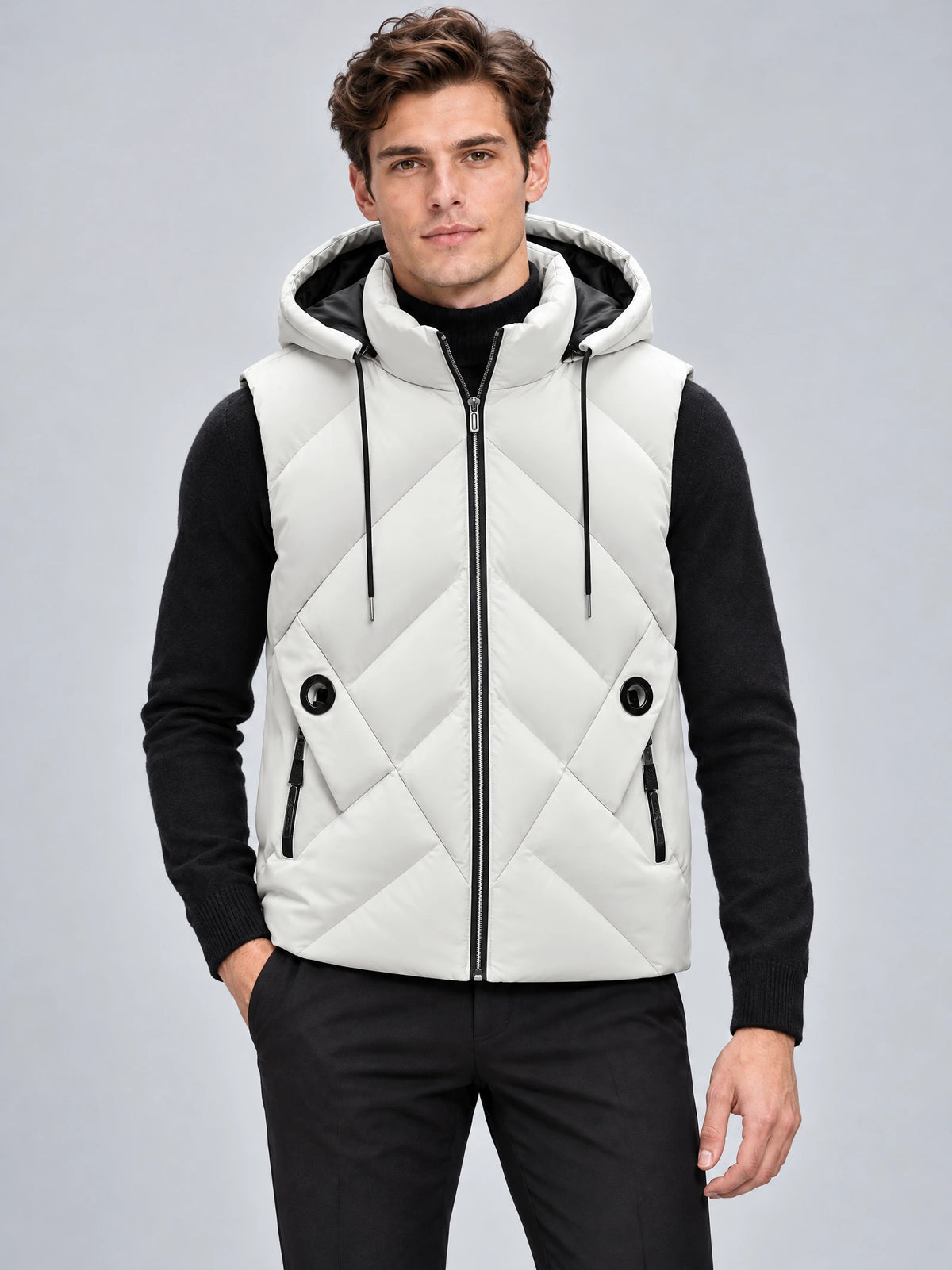 Front studio view of a model wearing a White Down Vest with a hood, zip closure, diagonal quilting, and zip pockets.
