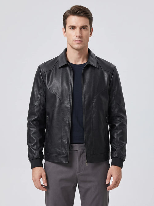 Front studio view of a model wearing a Black PU leather Fall Jacket with a zip front, pointed collar, and zippered pockets.