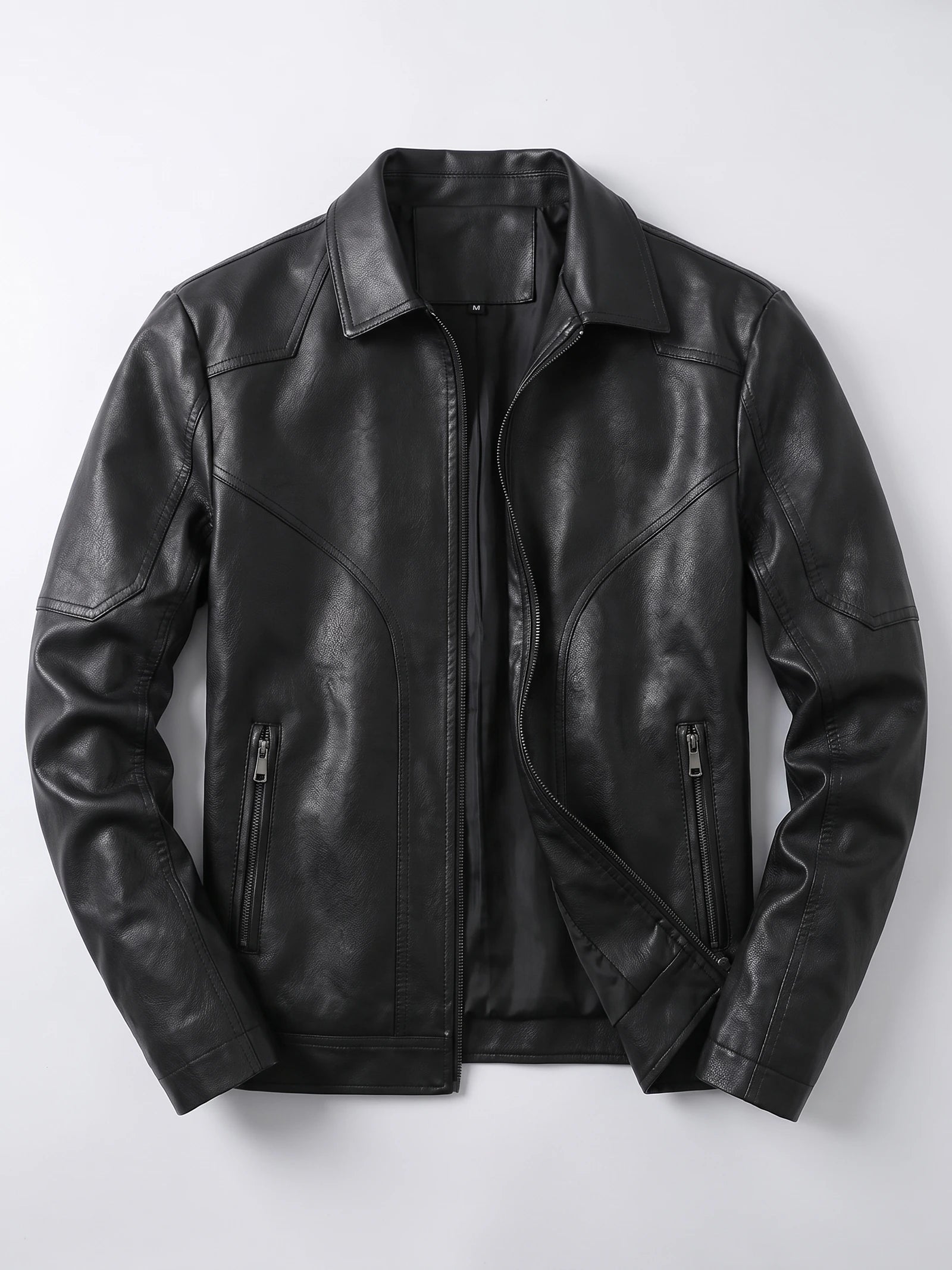 Black PU leather fall jacket laid flat, featuring an asymmetric front zipper, wide collar, and zippered pockets.