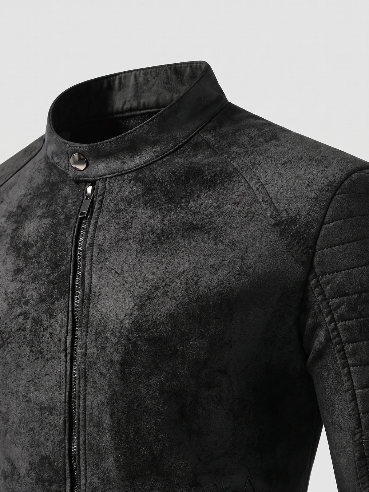 Close-up of a Black men’s Fall Jacket showing the faux leather stand collar, snap tab, front zipper, and quilted shoulder stitching.