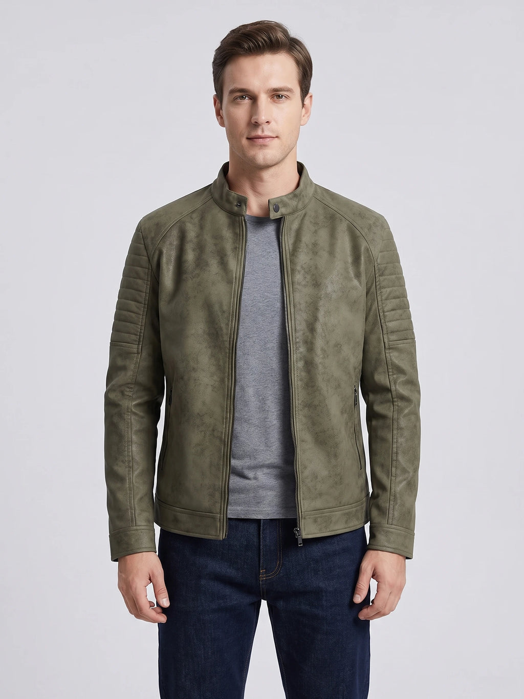 Front studio view of a model wearing a Green faux leather Fall Jacket with a stand collar, zip front, and quilted shoulder panels.