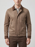 Front studio view of a model wearing a Brown faux Suede Jacket with a zip front, lapel collar, and flap pockets.