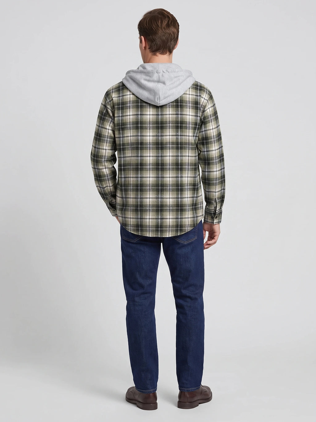 Rear studio view of a model wearing a Green plaid Flannel Jacket with a hood and long sleeves.